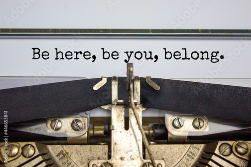 You belong here symbol. Words 'Be here, be You, belong' typed on retro typewriter. Diversity, inclusion, belonging and you belong here concept. Copy space.