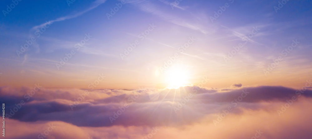 Panoramic view above clouds with beautiful sunset.