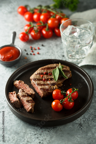 Grilled beef steak with tomatoes