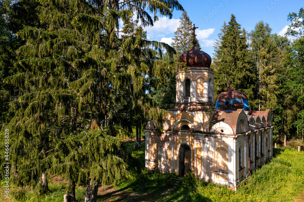 Fototapeta premium abandoned Orthodox Church in the forest, Galgauska, Latvia, disappearing history, aerial view