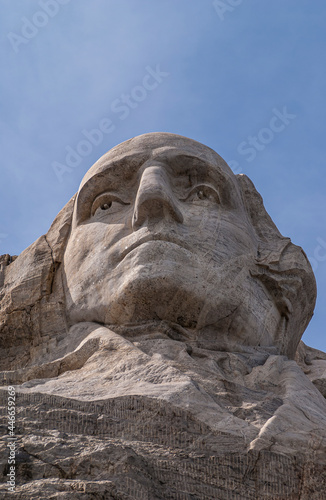 Black Hills, Keystone, SD, USA - May 31, 2008: Mount Rushmore. Closeup of President washington face sculpture in gray granite under blue sky. 