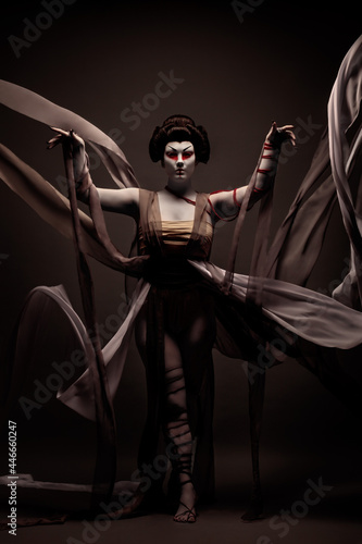 Obraz na plátně Geisha wearing a ceremonial dress creating voluptuousness in the wind