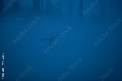 Fototapeta Naklejka Na Ścianę i Meble -  rowing on the river in the fog