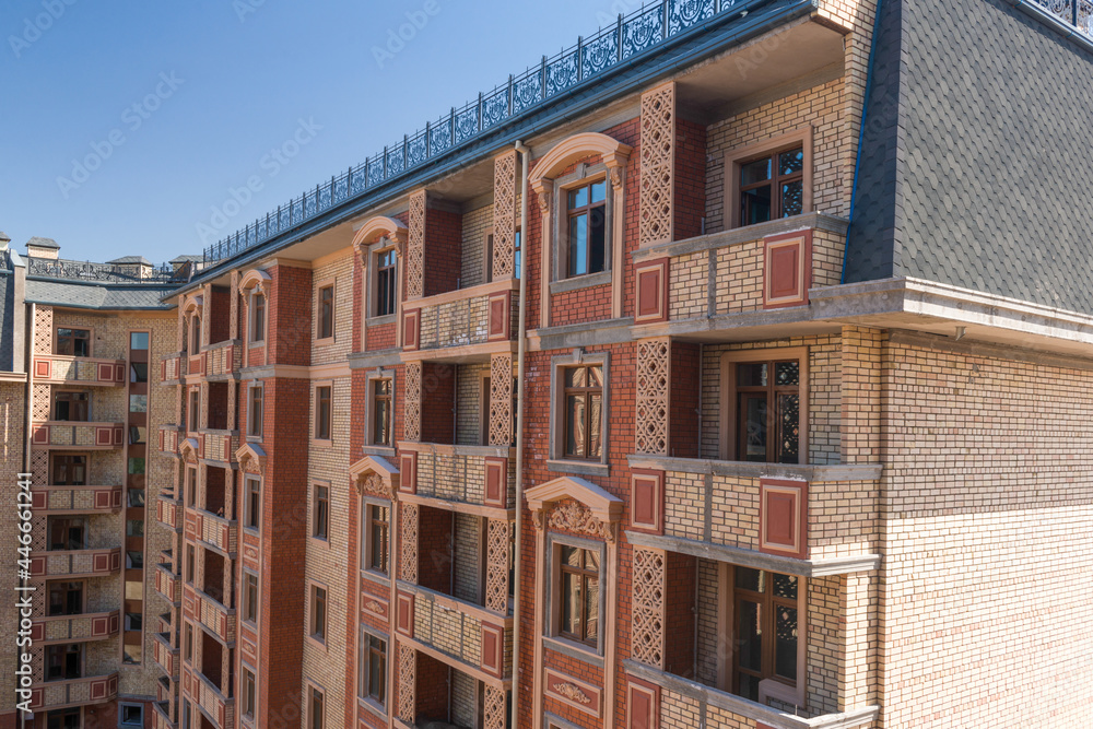 Naklejka premium Modern apartment complex design. Building under construction