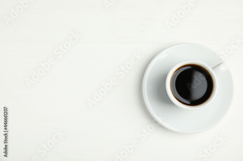 Cup of hot aromatic espresso on white background  top view