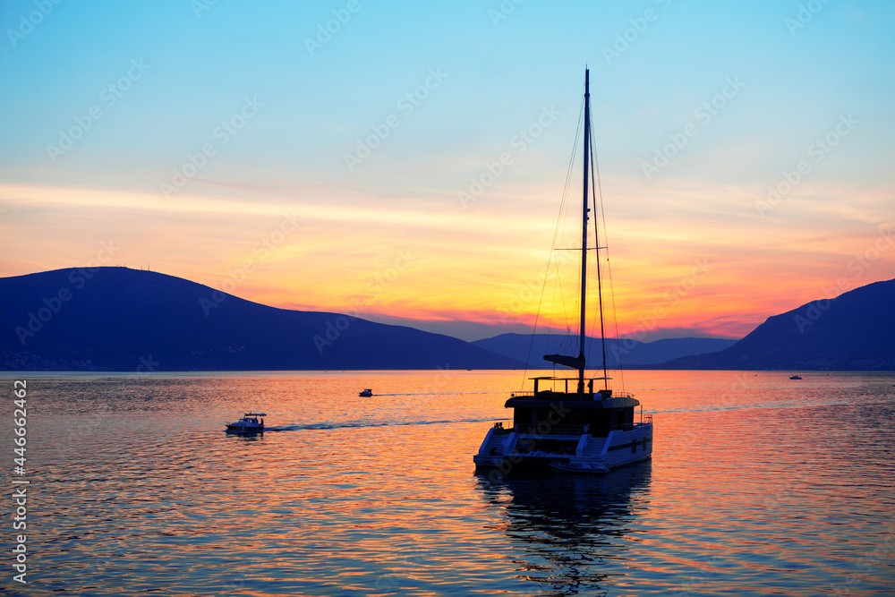 Luxury yacht in the dusk . Twilight over the bay . Millionaire yacht