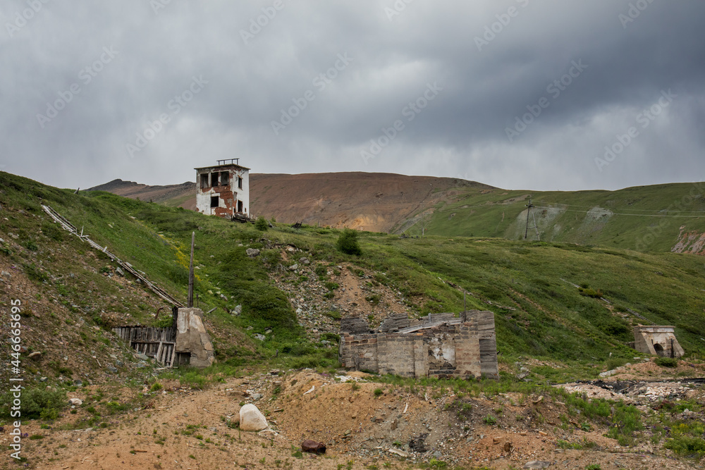 The building of an old abandoned mercury mine in the Altai Republic. An old brick building of the 20th century. Extraction of minerals in the highlands.
