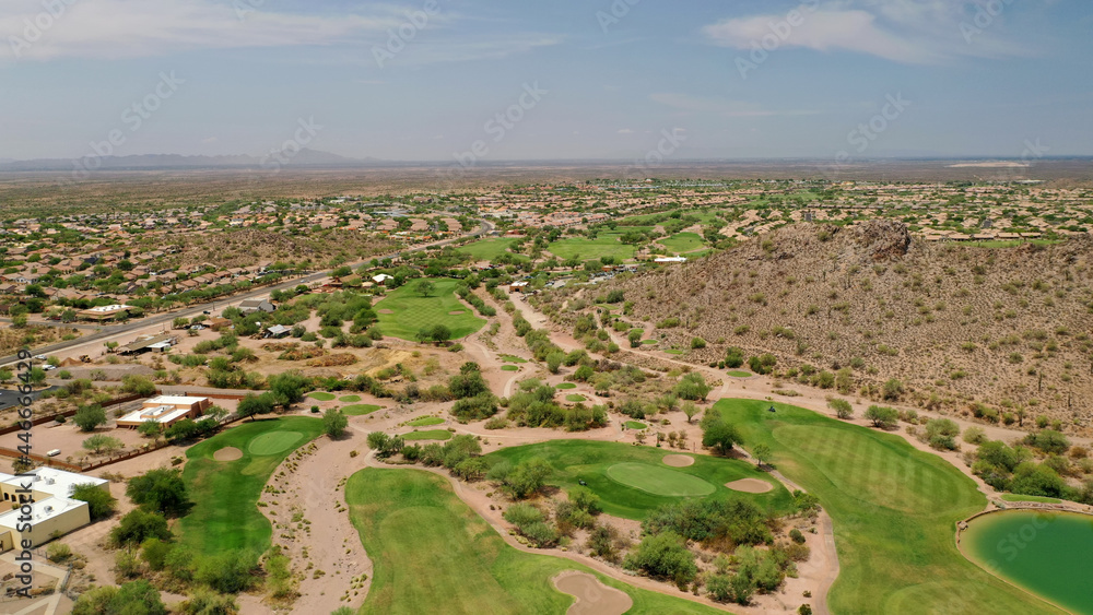 A high definition aerial view of a golf course located in the southwestern United States.