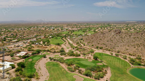A high definition aerial view of a golf course located in the southwestern United States. © phillips