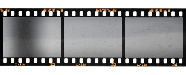 film strip, 3 blank photo frames, free space for your pictures, real 35mm film strip scan with signs of usage on white background.