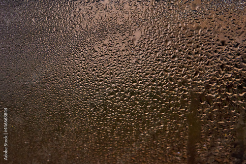 wet window glass with splashes and drops of water. horizontal
