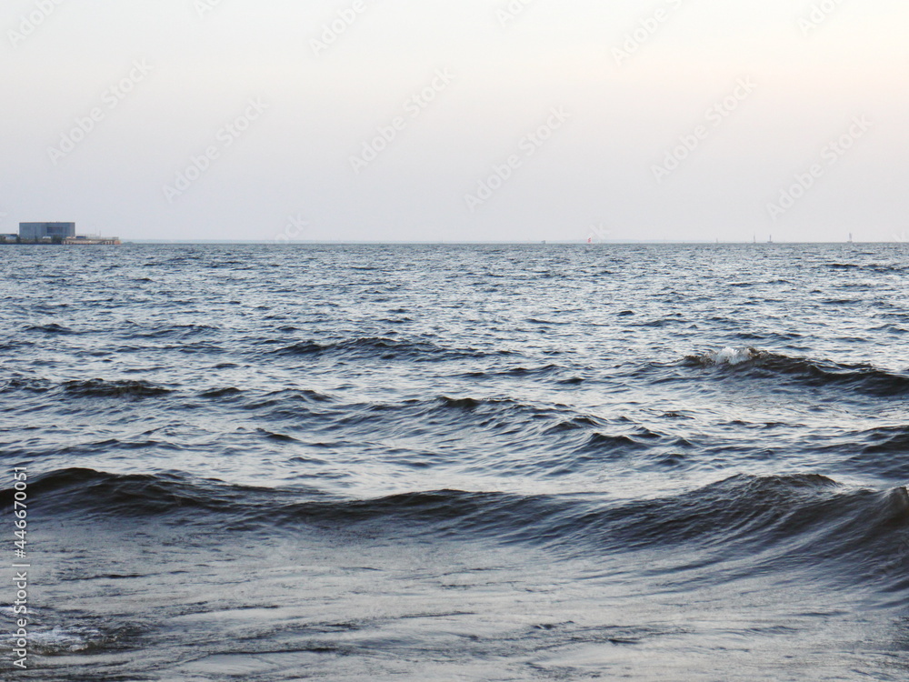 small surf waves on a sandy beach