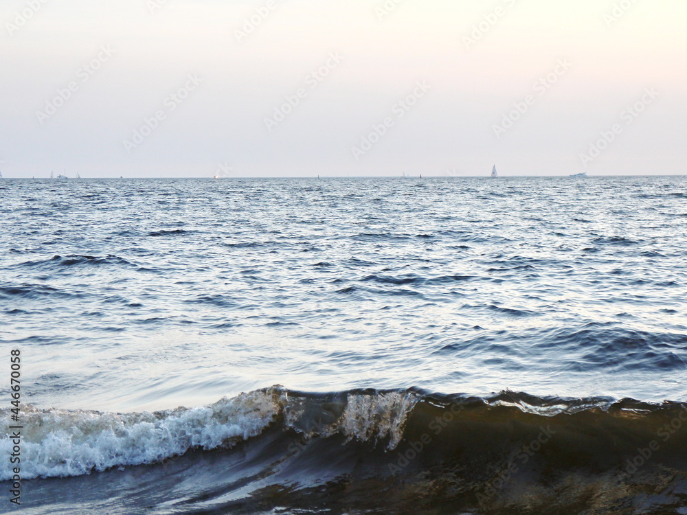 small surf waves on a sandy beach small surf waves on a sandy beach