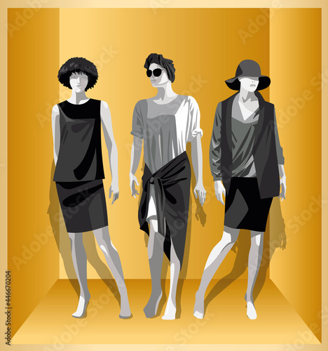 Female mannequin in black-white clothes on a yellow background.