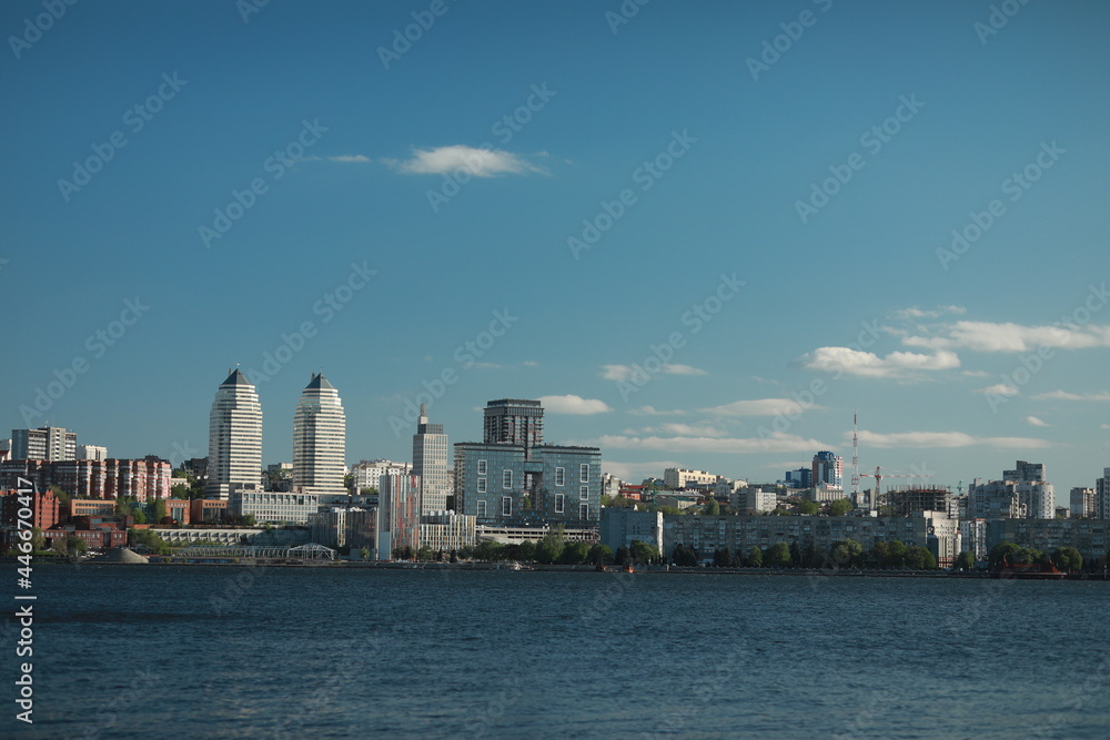 A large body of water with a city in the background