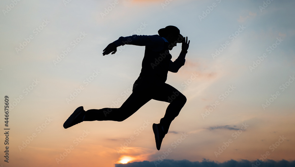 custom made wallpaper toronto digitalsilhouette of man running in sense of freedom on sunrise sky, stamina
