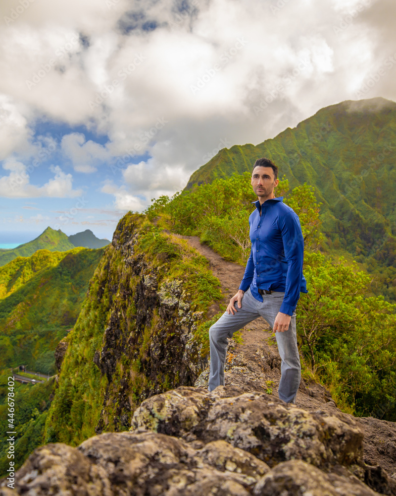 Man hiking modeling in the Mountains of Hawaii
