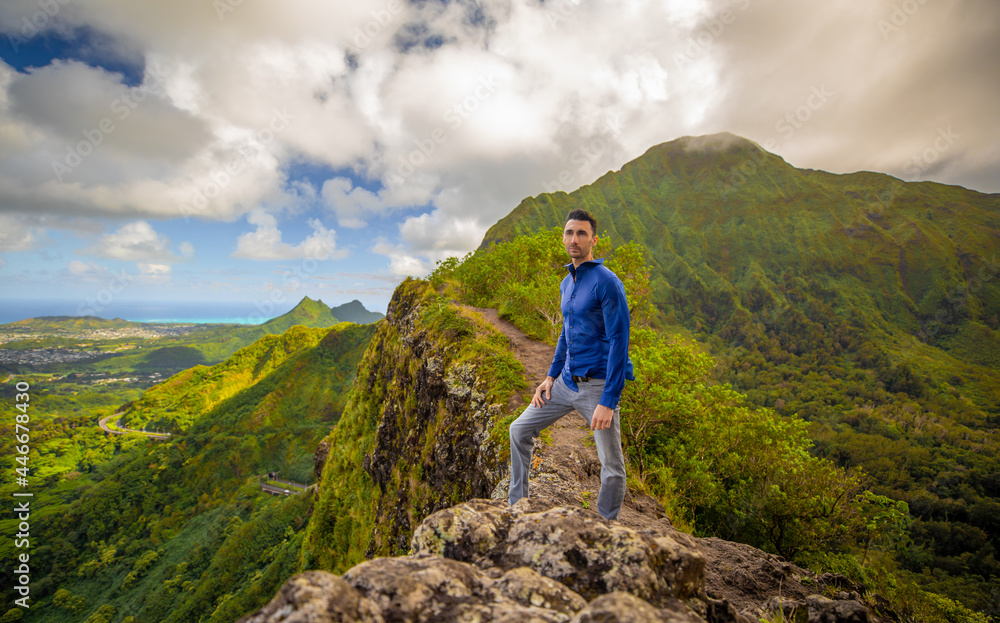 Man hiking modeling in the mountains of Hawaii

