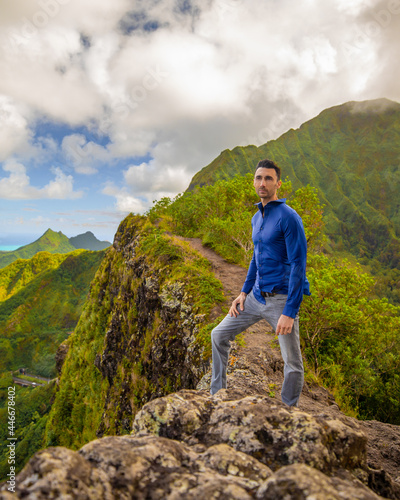 Man hiking modeling in the Mountains of Hawaii
