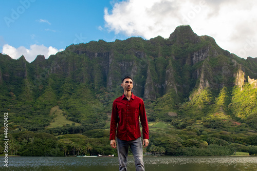 Man standing in front of Hawaii mountains