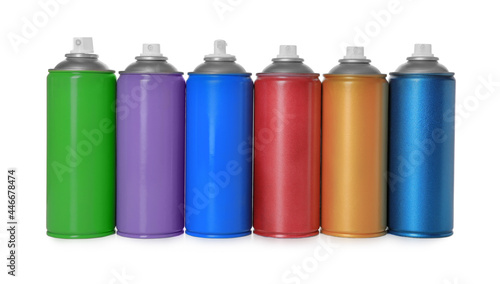 Cans of different spray paints on white background. Graffiti supplies