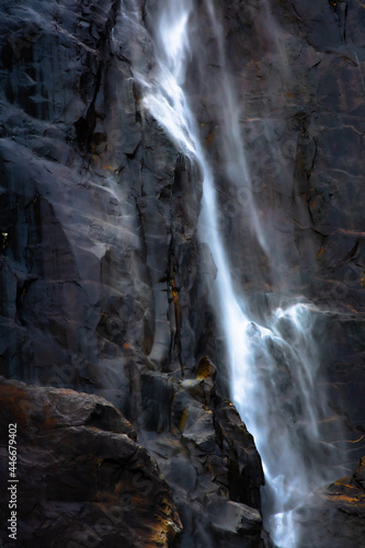 Beautiful waterfall against black rocks © Daniel