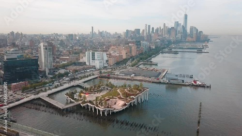 Little Island park at Pier 55 in New York new landmark of the city with Manhattan skyscrapers rising above photo