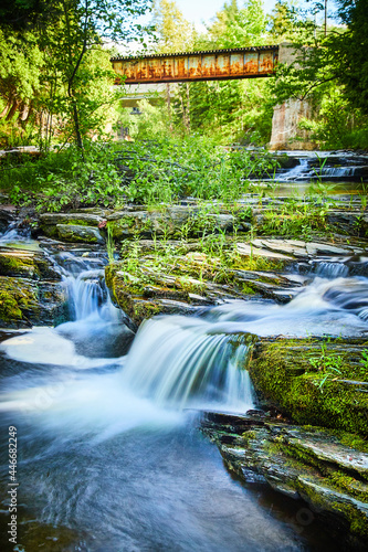 Cascading waterfalls surrounded by green trees