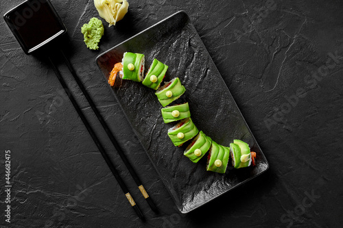 Sushi rolls with shrimp, tobiko, cream cheese and avocado