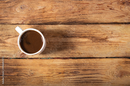 one cup coffee on wooden background