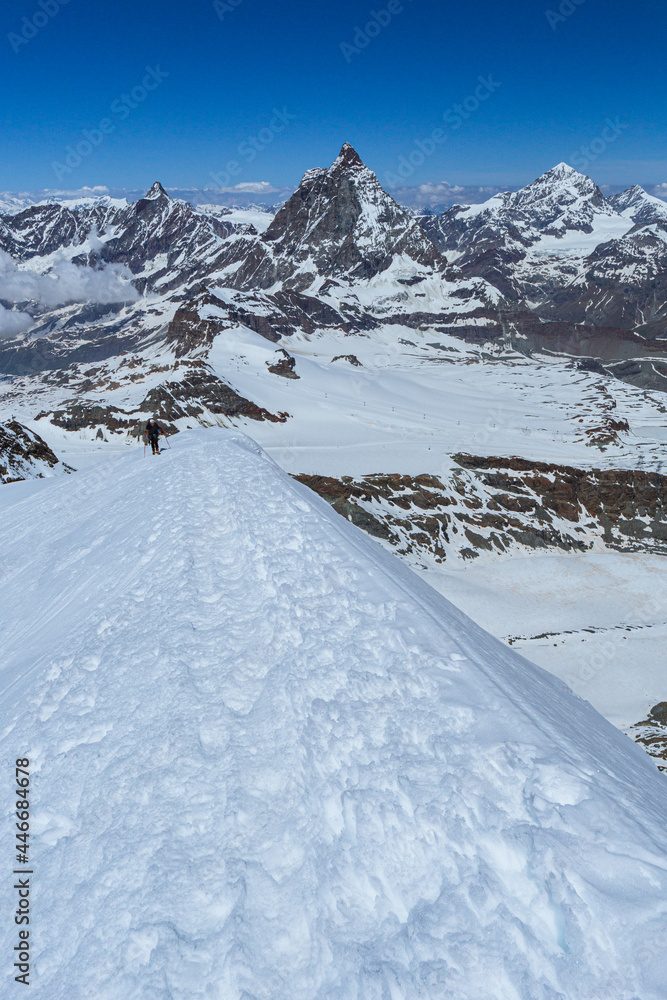 Obraz premium The matterhorn: one of the most iconic and famous mountains in the Alps. The Cima is surrounded by glaciers, rock faces and fantastic landscapes near the town of Cervinia, Italy - June 2021