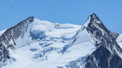 The peaks of Monte Rosa covered by glaciers near the village of Zermatt, Switzerland - June 2021 © Roberto