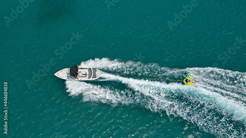 Wallpaper Mural Aerial photo of extreme power boat donut water-sports cruising in high speed in tropical emerald bay Torontodigital.ca