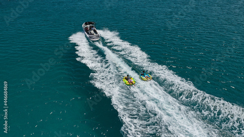 Slika na platnu Aerial photo of extreme power boat donut water-sports cruising in high speed in