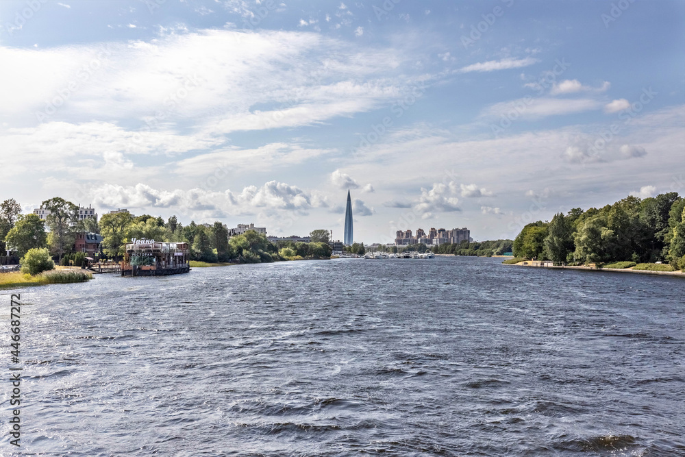 Fototapeta premium Urban landscape from the bridge to the river and the city