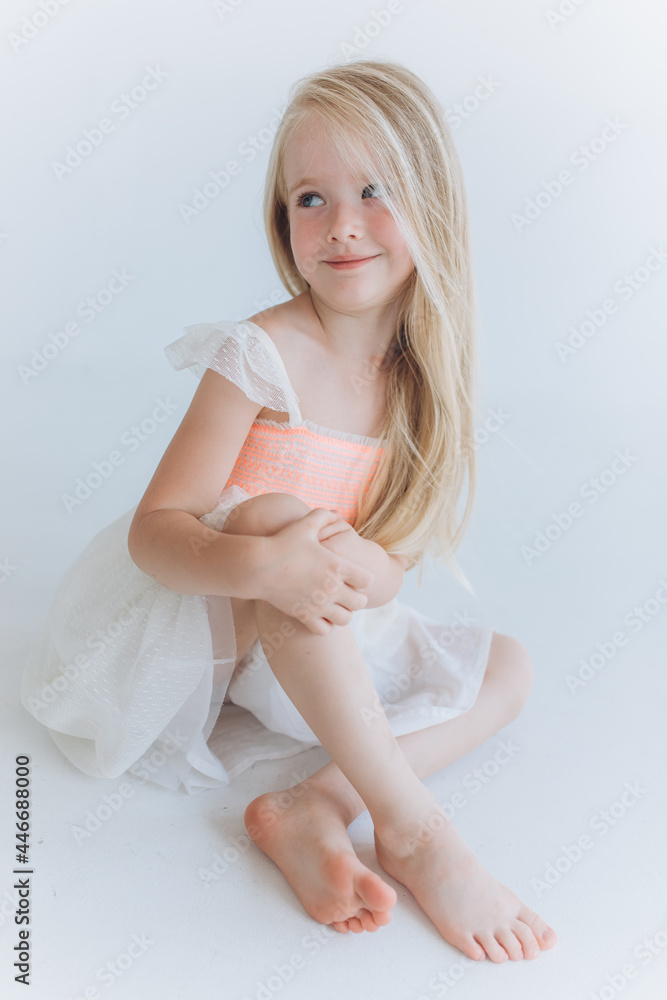 Blondie little caucasian adorable positive girl isolated on white  background Stock Photo