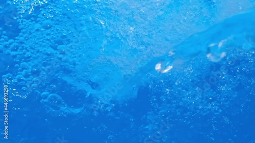 Wallpaper Mural Sparkling overflowing bright blue transparent water in hot tub or swimming pool. Video banner full HD resolution. Decorative jet or waterfall of water in the pool. Slow motion video. Torontodigital.ca