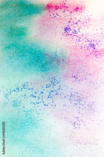 Pink-green watercolor stains with sparkles. Abstract background