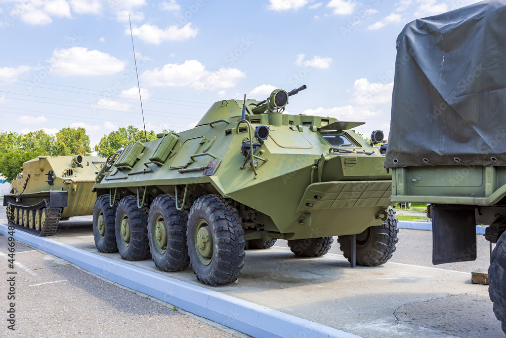 An old khaki armored vehicle for transporting soldiers and conducting combat An old khaki armored vehicle for transporting soldiers and conducting combat