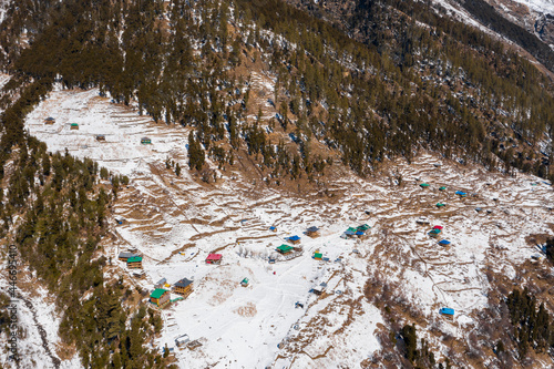 Aerial view of a campsite on mountain top with snow in Negi's Waichin Camps, Magic Valley in Kuala, Himachal Pradesh, India. photo