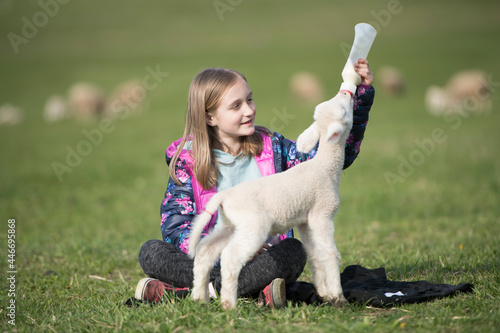 Little girl with a lamb