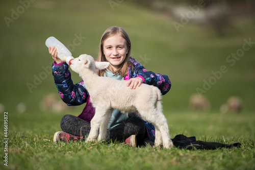 Little girl with a lamb