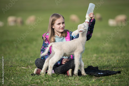 Little girl with a lamb