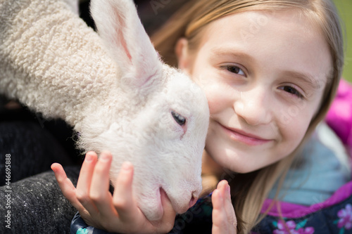 Little girl with a lamb