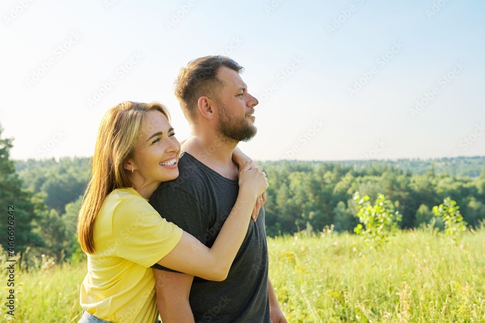 Portrait of happy middle-aged couple on summer sunny day