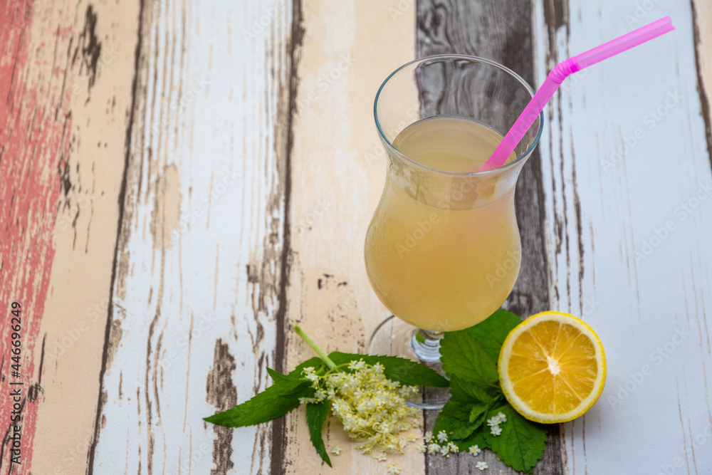 Fototapeta premium glass of elder flower drink knonw as socata in romanian, with lemon and mint