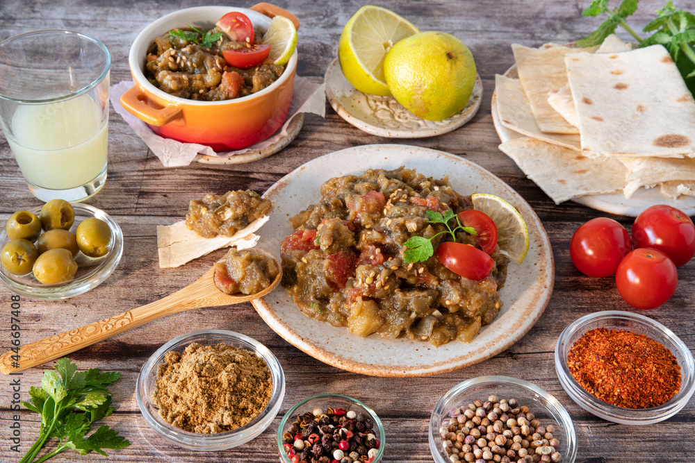 Aubergine caviar dish with surrounding ingredients