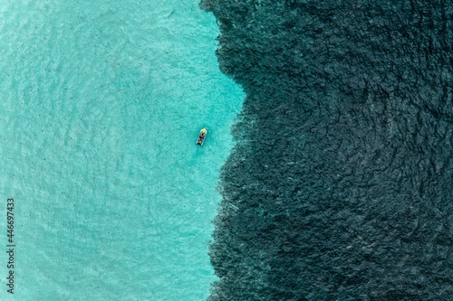 Aerial view of People on a Jetski cruising in the ocean, Caribbean Sea, Grand Cul de Sac Marin, Sainte Rose, Les Antilles, Guadeloupe, Eastern Caribbean Island. photo