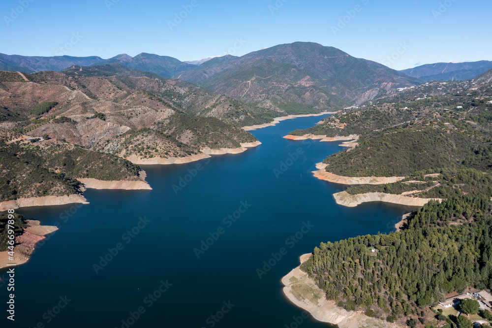 Aerial view of Embalse de la Concepcion lake among the mountains near Marbella, Malaga, Andalusia, Spain. Aerial view of Embalse de la Concepcion lake among the mountains near Marbella, Malaga, Andalusia, Spain.