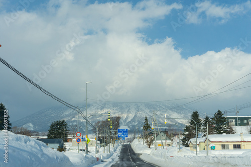 Beautiful Winter Landscape with Winter forest under the snow , powder snow on a road in, Hokkaido Japan view from inside car.